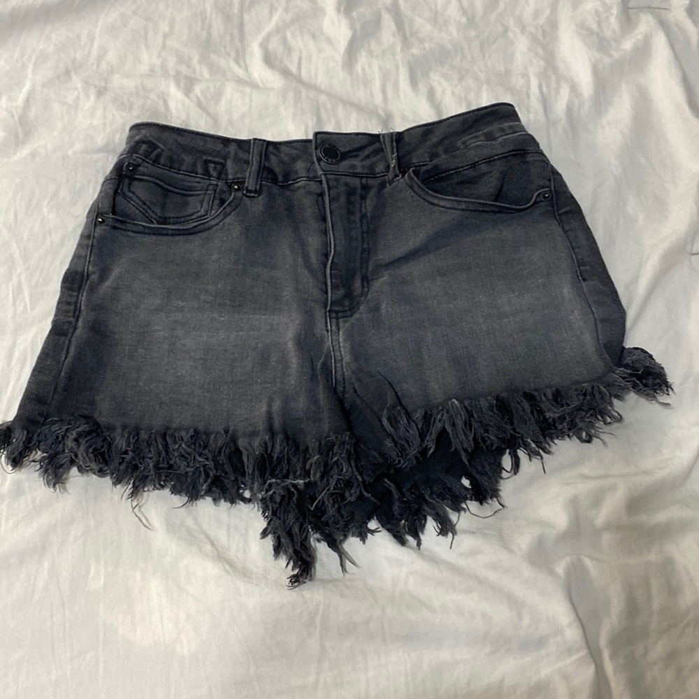 Black distressed shorts. Says size 7 but more of a 5 and are super stretchy.